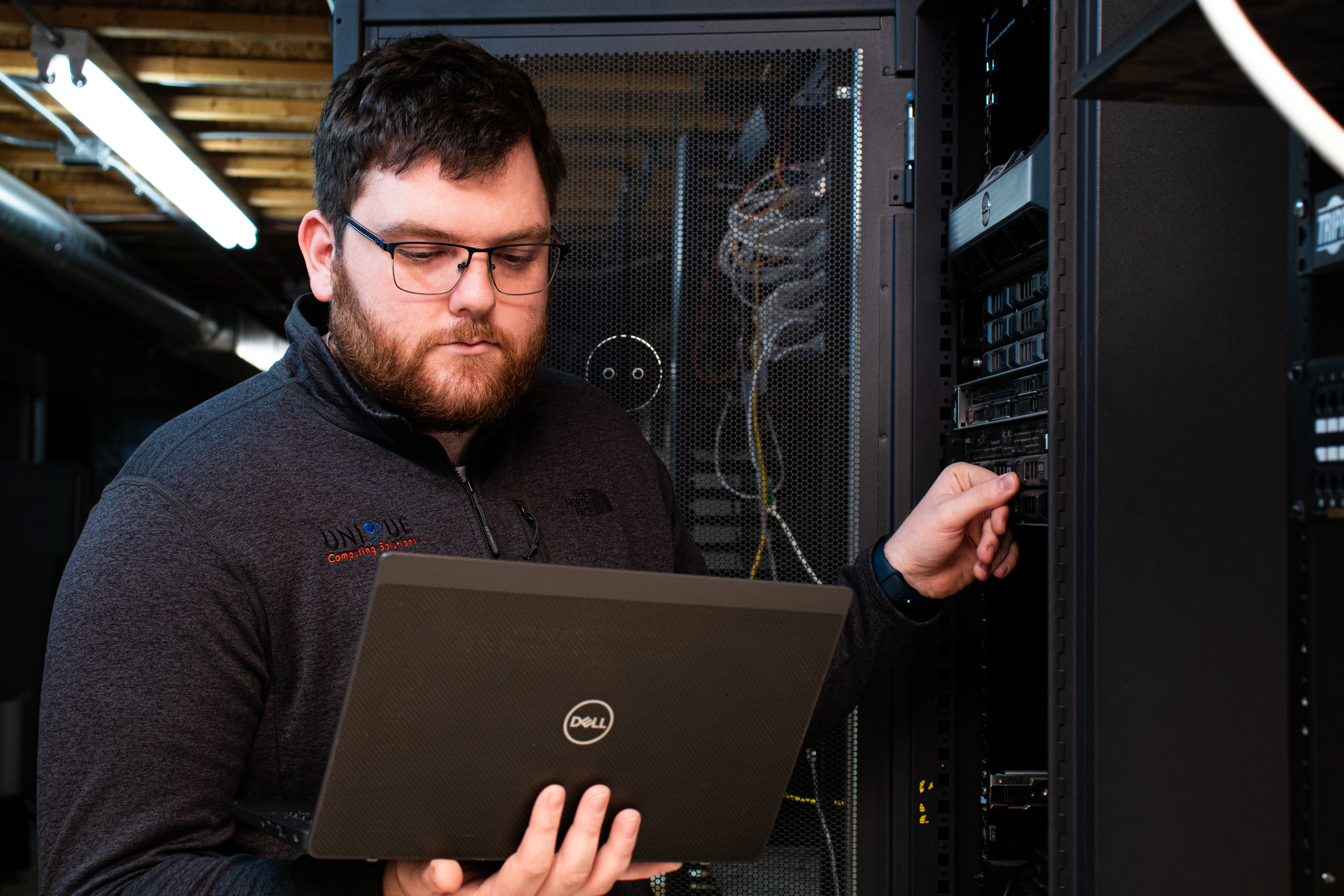 CMMC Compliance Doug Pressing Buttons At Server Rack